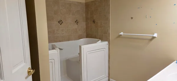 a view of house with backyard and garden