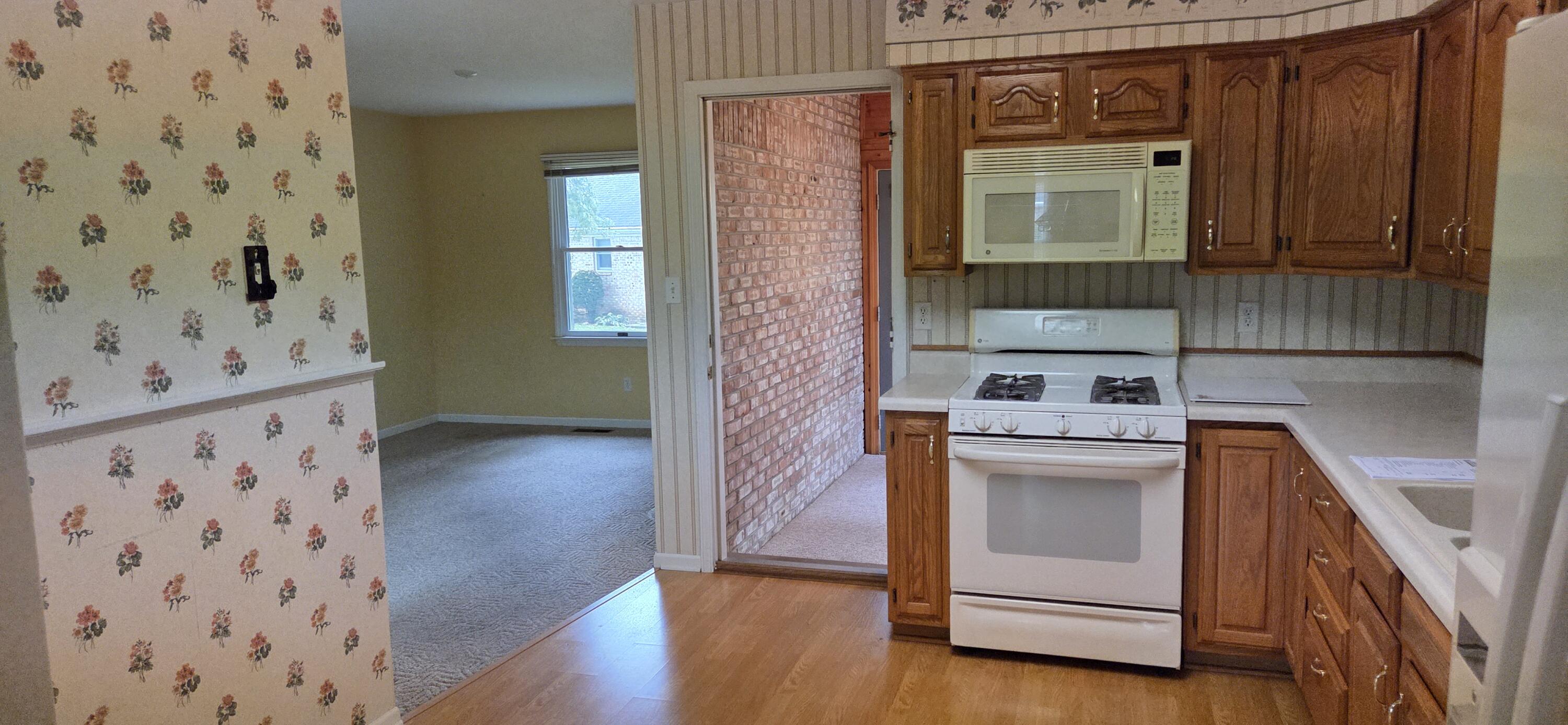 628 B Begonia Street Southeast De Motte, IN 46310 - Photo 4 of 17 a view of a hallway with washer and dryer
