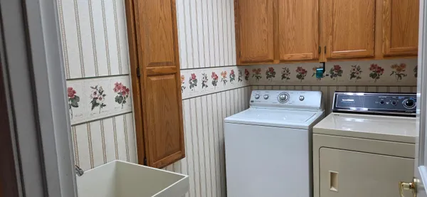 a utility room with dryer and washer