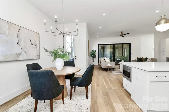 a view of a workspace room with furniture and a potted plant