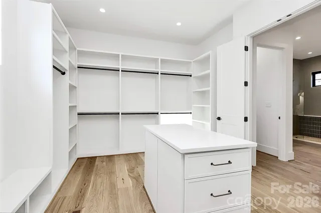 a bathroom with a toilet a sink a shower and a mirror