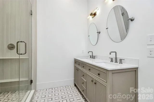 a white bath tub sitting next to a white wall