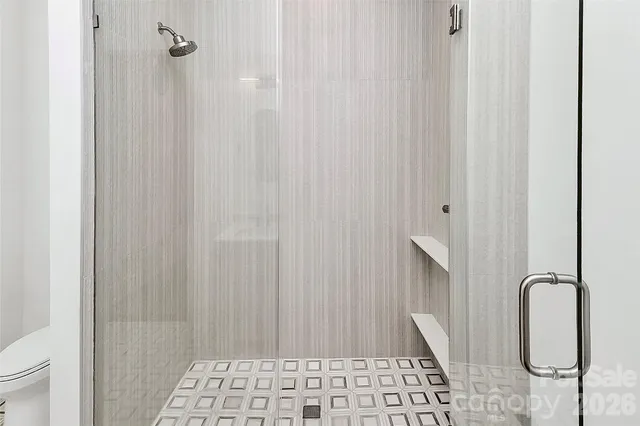 a balcony with wooden floor and wooden fence