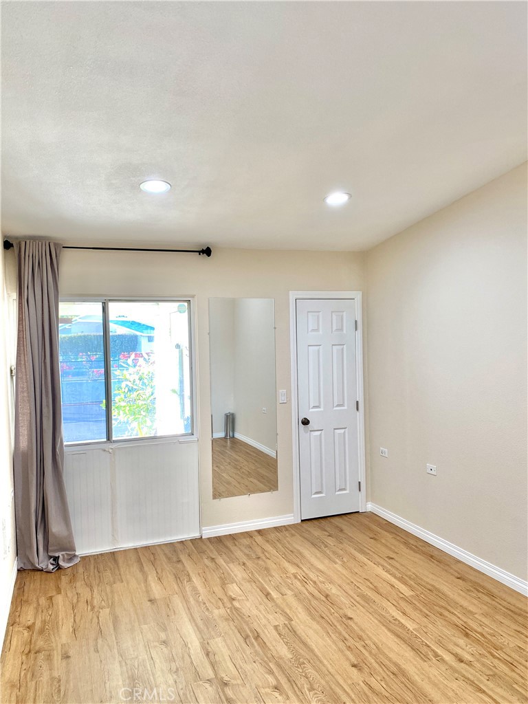 1312 Golden Rain Road Seal Beach, CA 90740 - Photo 17 of 38 main bedroom with window to front porch