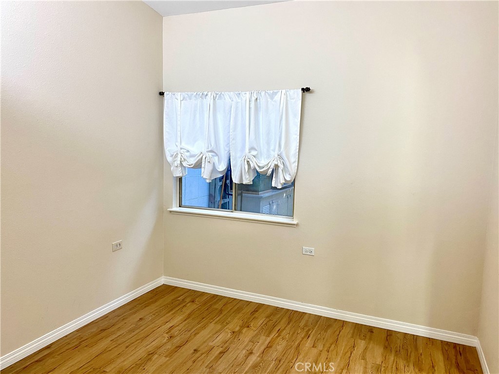 1312 Golden Rain Road Seal Beach, CA 90740 - Photo 21 of 38 2nd bedroom with window to patio area