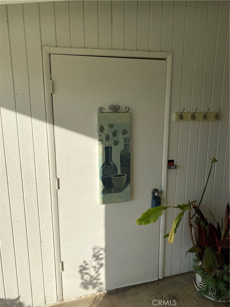 1312 Golden Rain Road Seal Beach, CA 90740 - Photo 25 of 38 small storage closet at front porch