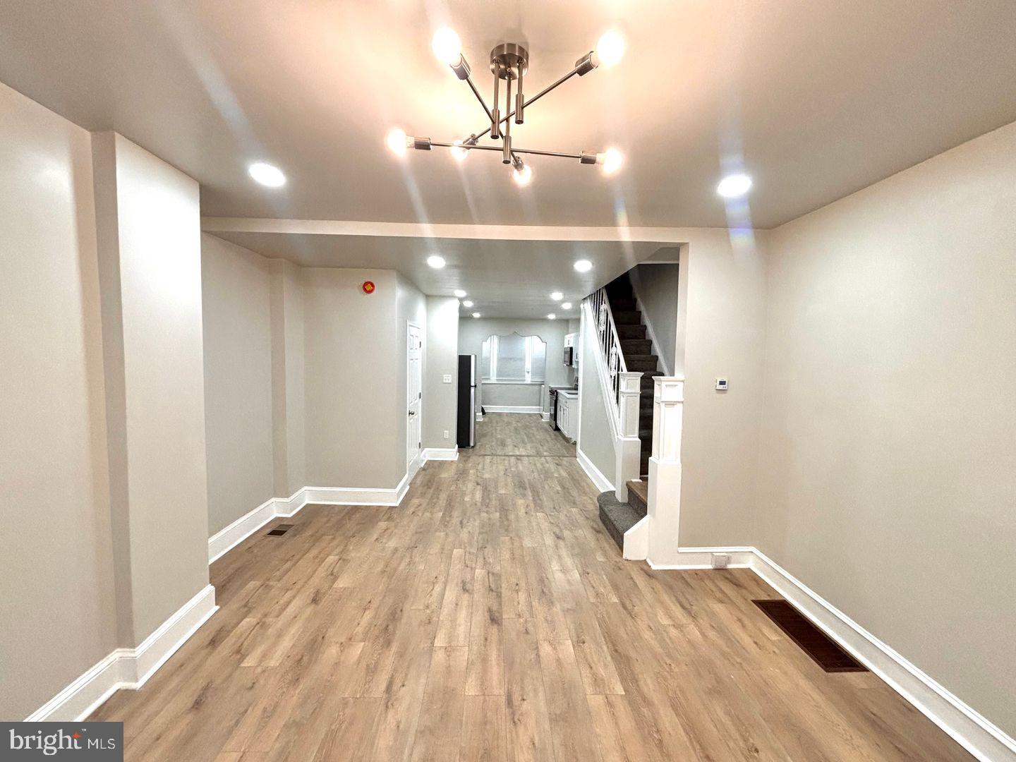 3023 Redner Street Philadelphia, PA 19121 - Photo 13 of 22 a view of a hallway with a chandelier