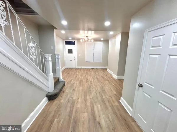 a kitchen with stainless steel appliances kitchen island granite countertop a stove a sink and a microwave