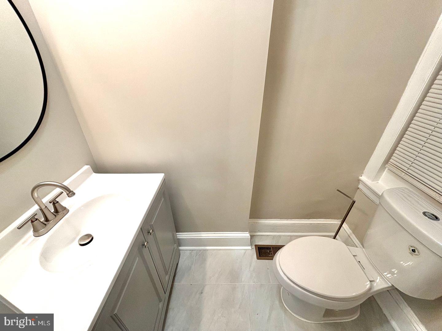 3023 Redner Street Philadelphia, PA 19121 - Photo 16 of 22 a bathroom with a sink and a mirror