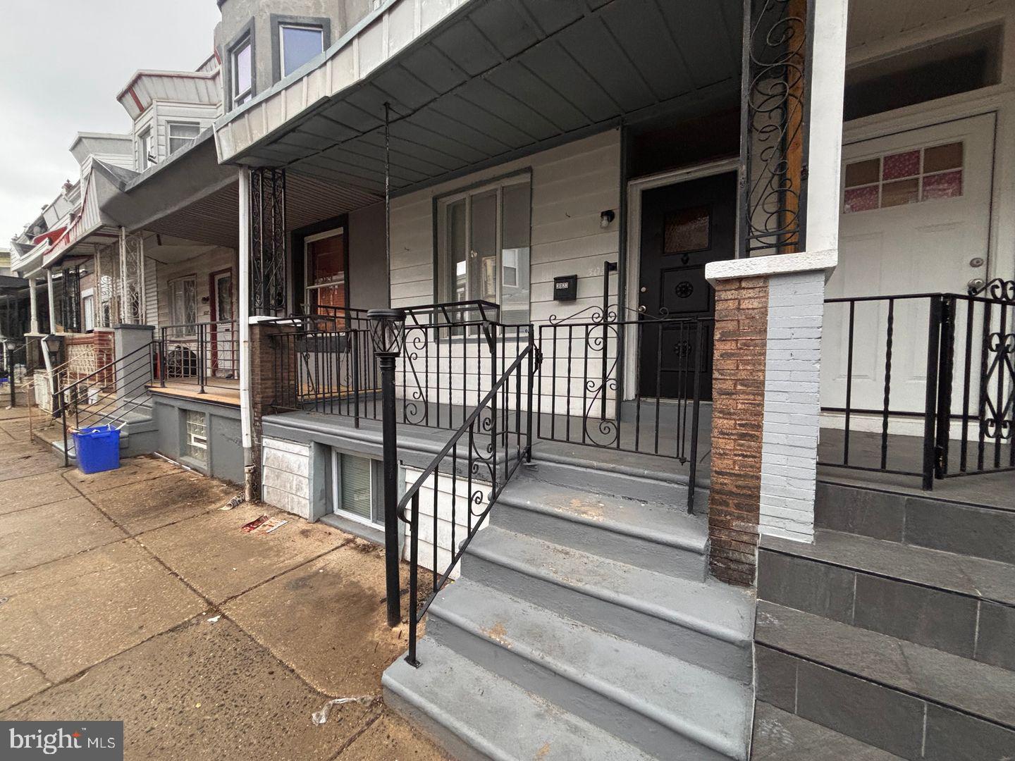 3023 Redner Street Philadelphia, PA 19121 - Photo 2 of 22 a view of a house with wooden fence and two windows