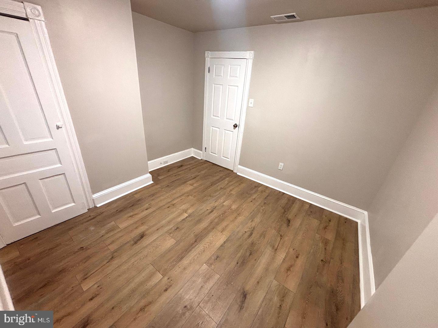 3023 Redner Street Philadelphia, PA 19121 - Photo 4 of 22 wooden floor in an empty room
