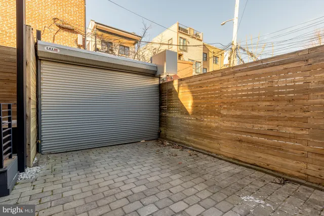 a view of a backyard with pathway