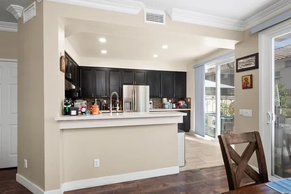 a view of kitchen with cabinets and outdoor space