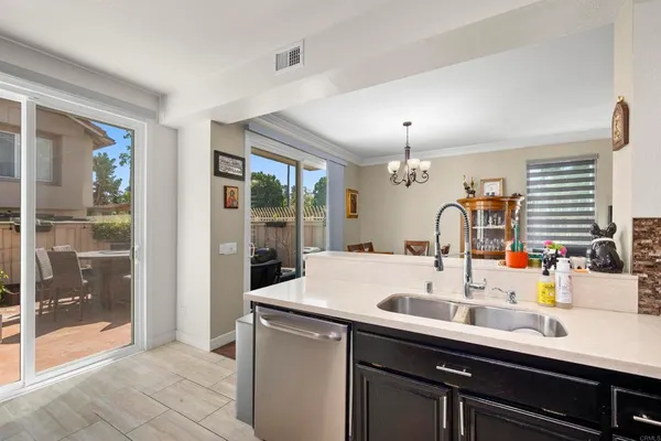 a kitchen with a sink and a refrigerator
