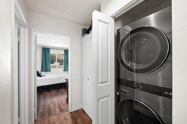 a view of a hallway with washer and dryer