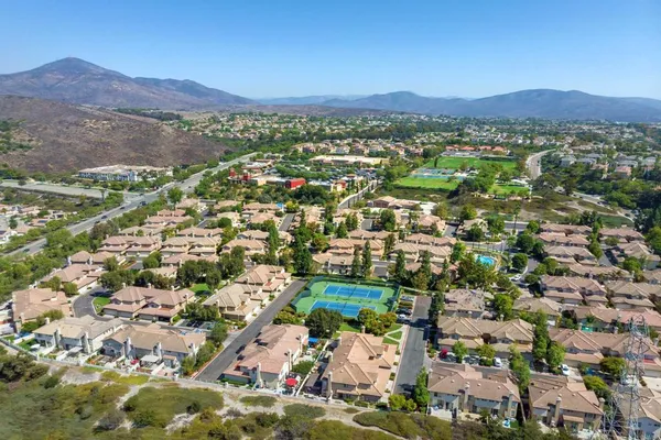 an aerial view of residential house and sandy dunes