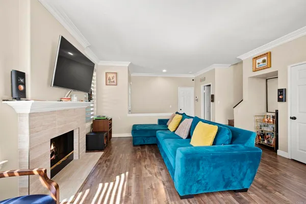 a living room with furniture and a fireplace