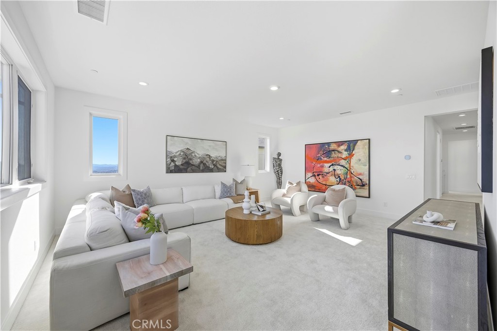 20138 Marlow Lane Porter Ranch, CA 91326 - Photo 18 of 39 a living room with furniture and wall paintings