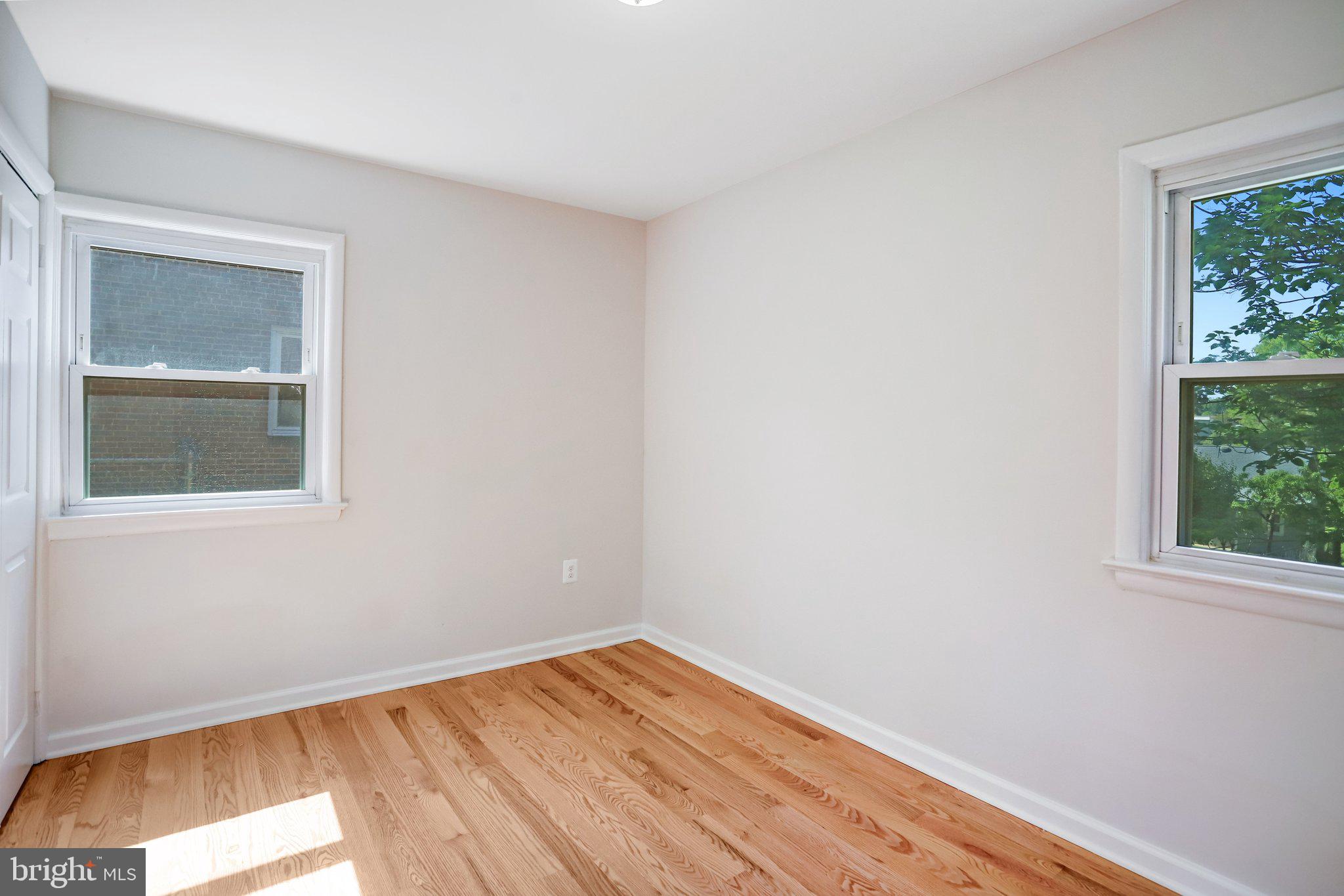 616 Ritchie Avenue Silver Spring, MD 20910 - Photo 15 of 37 a view of empty room with wooden floor and fan
