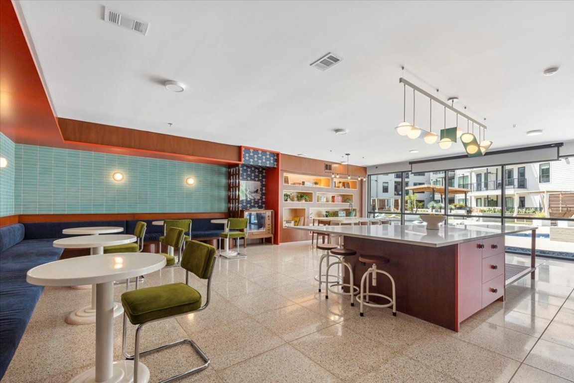 1701 Simond Avenue, Unit 636 Austin, TX 78723 - Photo 21 of 34 a view of a swimming pool with outdoor seating