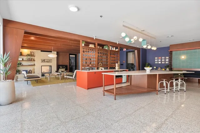 a living room with furniture a rug and a fireplace