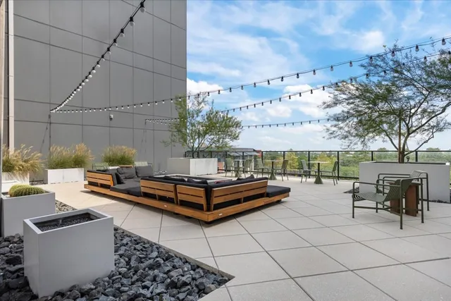 a living room with furniture and kitchen view