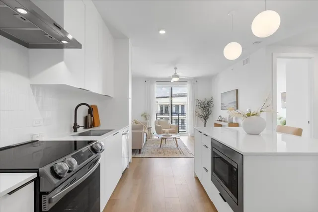 a kitchen with a stove and a sink
