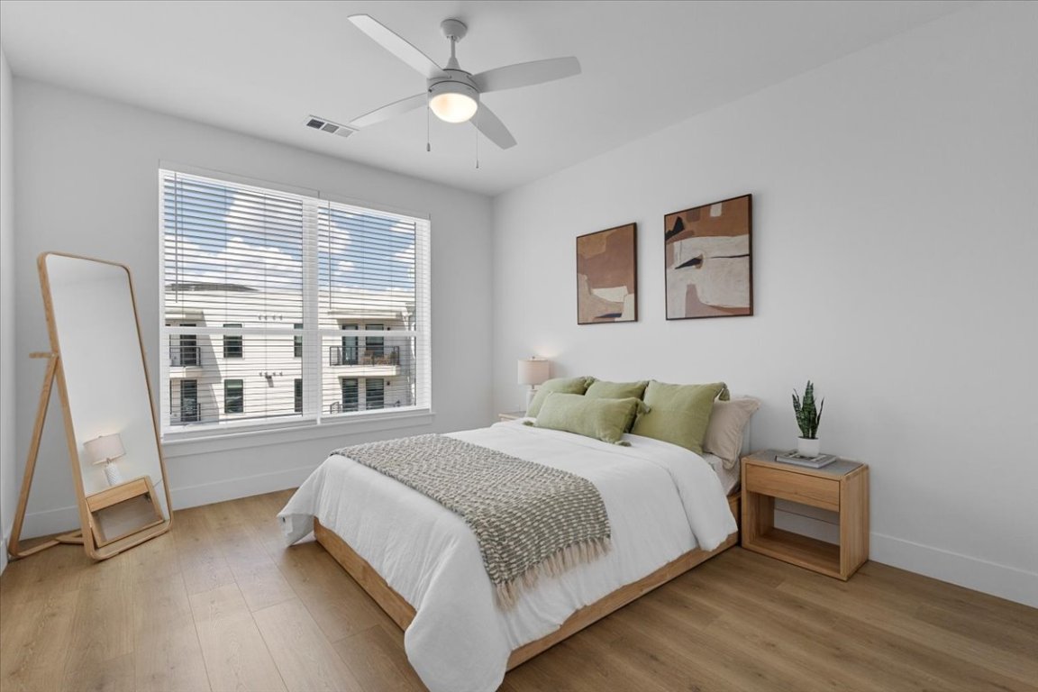 1701 Simond Avenue, Unit 636 Austin, TX 78723 - Photo 10 of 34 a bedroom with a bed and a window
