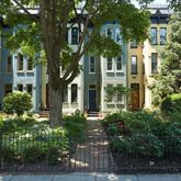 front view of a residential houses with yard and green space