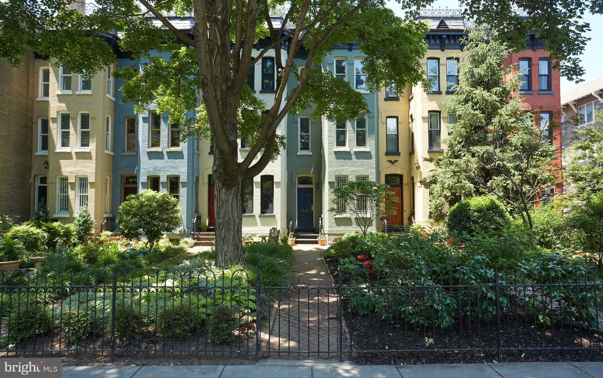 front view of a residential houses with yard and green space