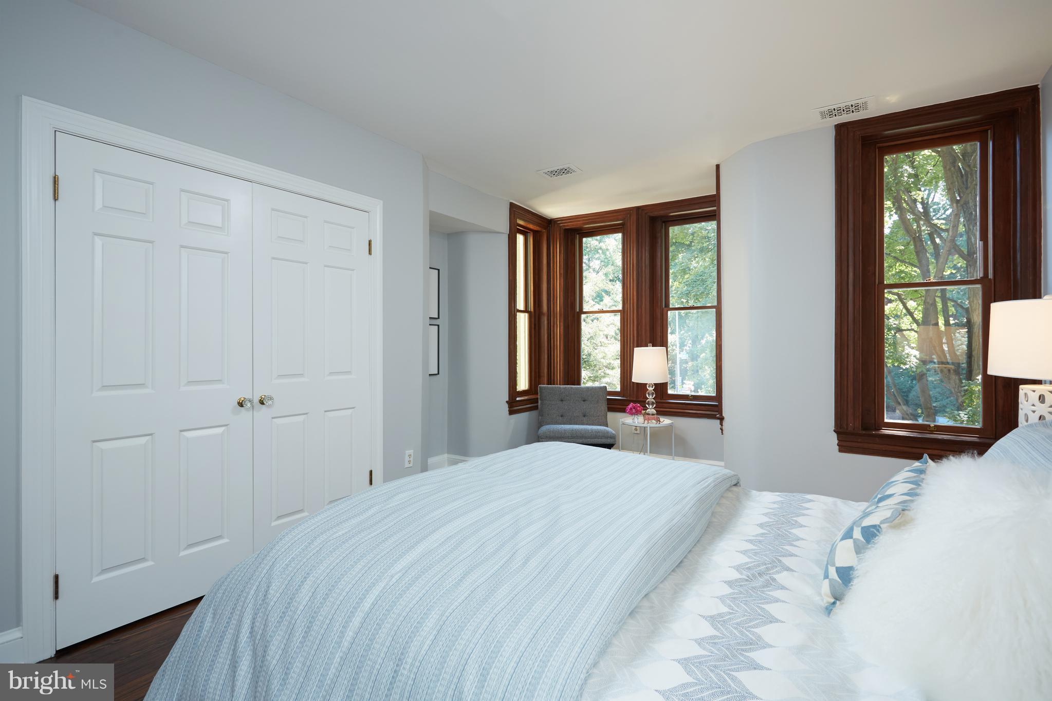1822 16th Street Northwest Washington, DC 20009 - Photo 12 of 29 a bedroom with a bed and two large window