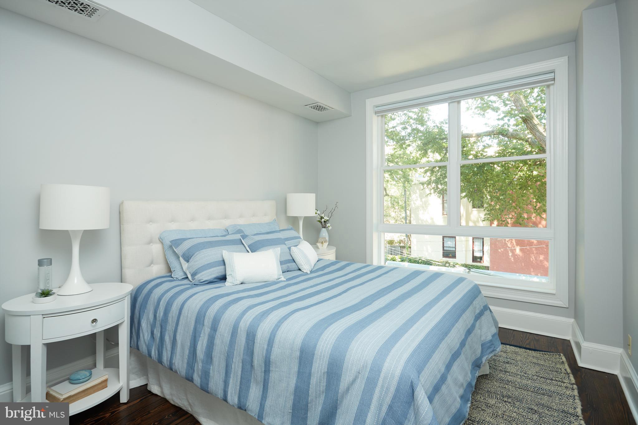 1822 16th Street Northwest Washington, DC 20009 - Photo 13 of 29 a bedroom with a bed and a window