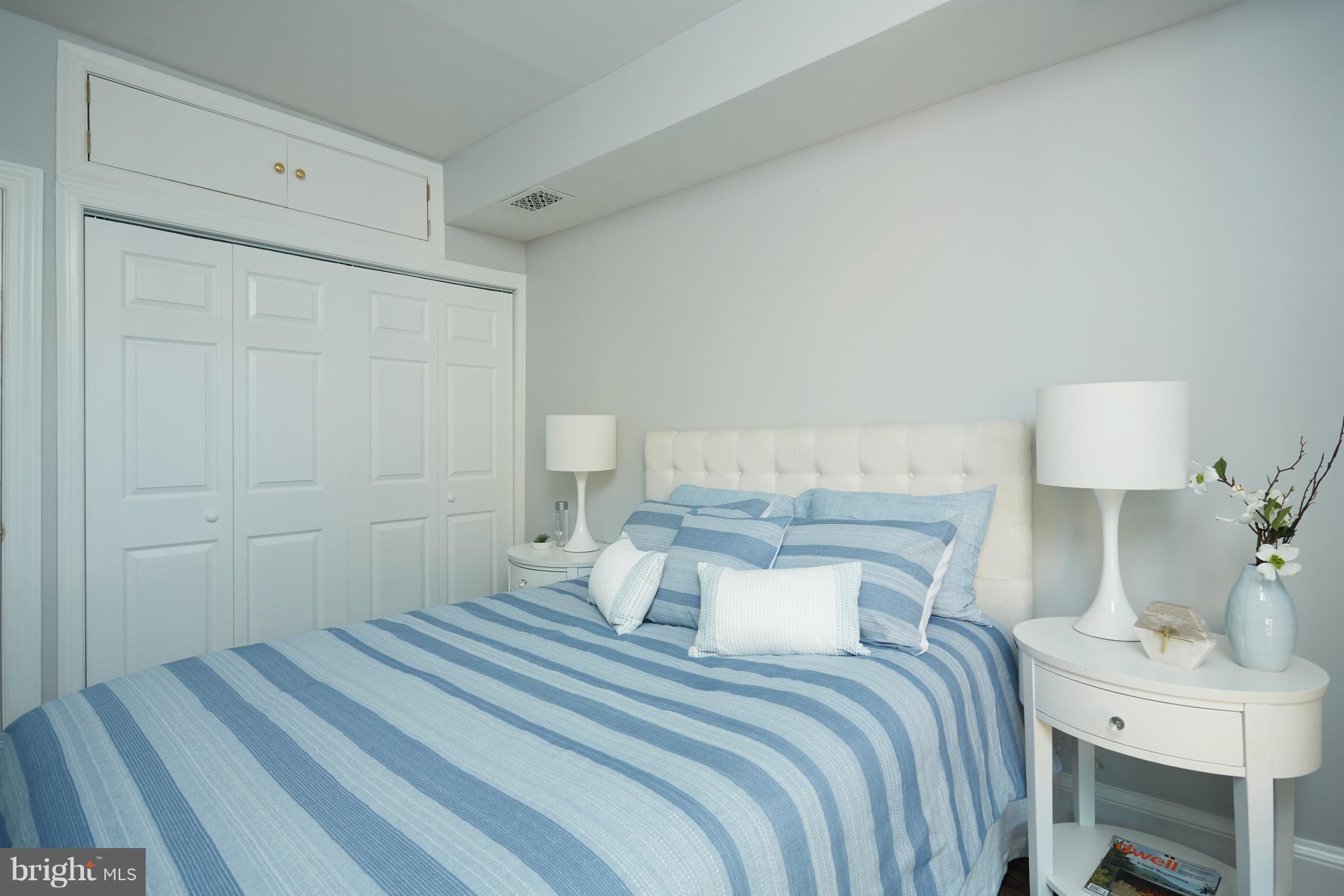 1822 16th Street Northwest Washington, DC 20009 - Photo 14 of 29 a bedroom with a bed and a table