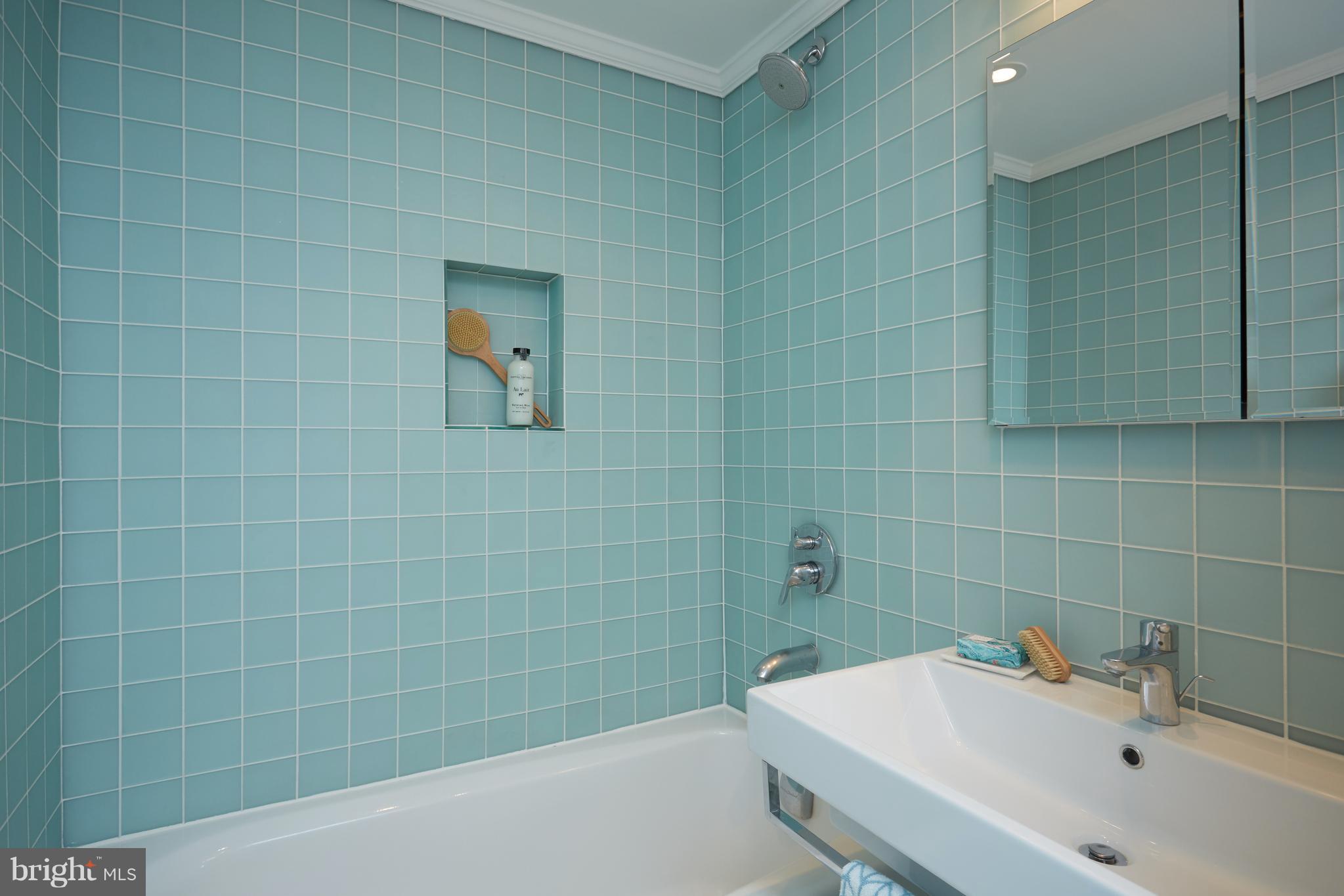 1822 16th Street Northwest Washington, DC 20009 - Photo 15 of 29 a bathroom with a sink and mirror