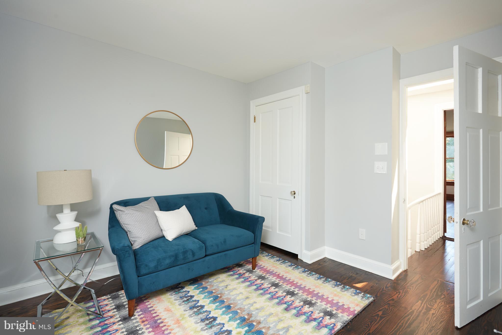 1822 16th Street Northwest Washington, DC 20009 - Photo 19 of 29 a living room with furniture and a rug