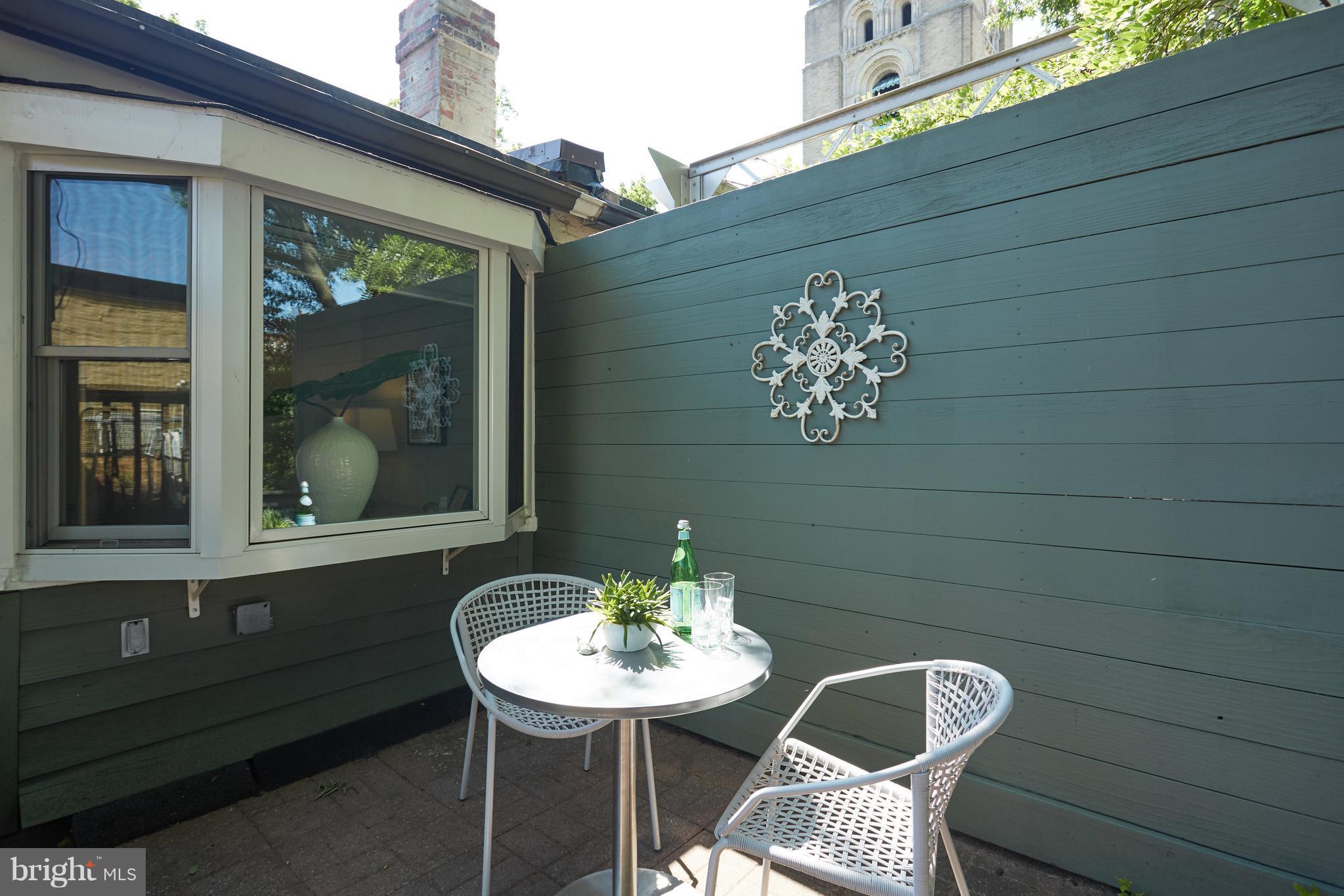 1822 16th Street Northwest Washington, DC 20009 - Photo 23 of 29 a table and chairs in a patio