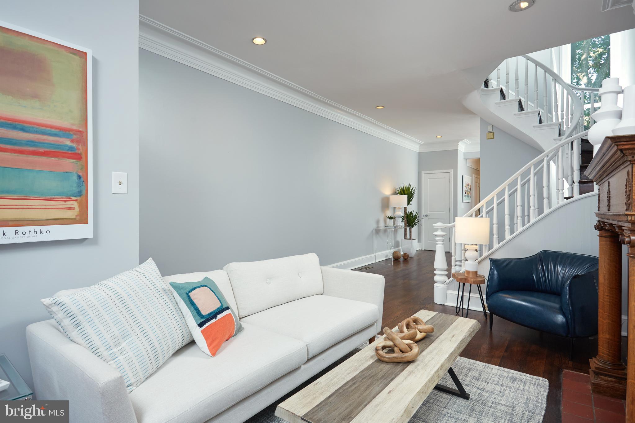 1822 16th Street Northwest Washington, DC 20009 - Photo 4 of 29 a living room with furniture and a rug