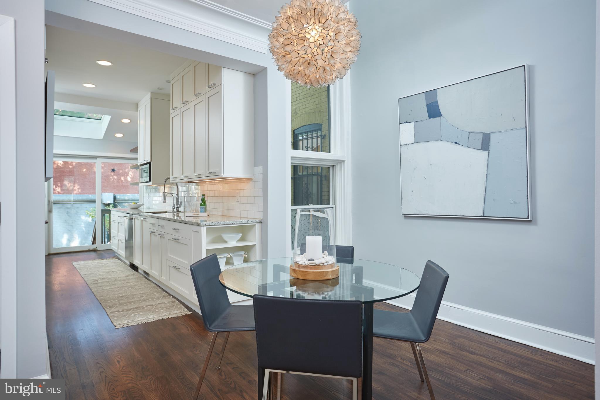 1822 16th Street Northwest Washington, DC 20009 - Photo 5 of 29 a dining room with furniture and window