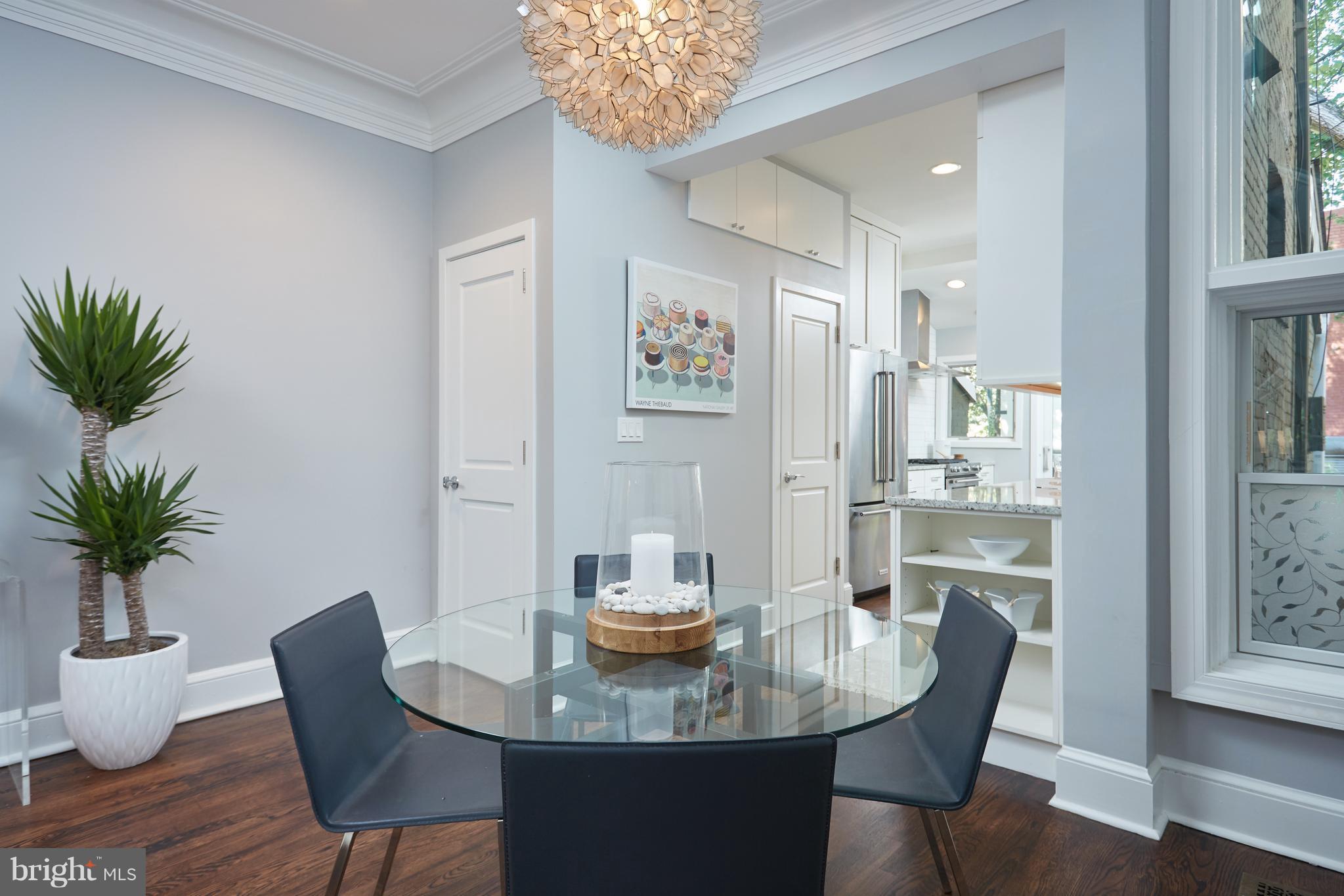 1822 16th Street Northwest Washington, DC 20009 - Photo 6 of 29 a view of a dining room with furniture window and wooden floor