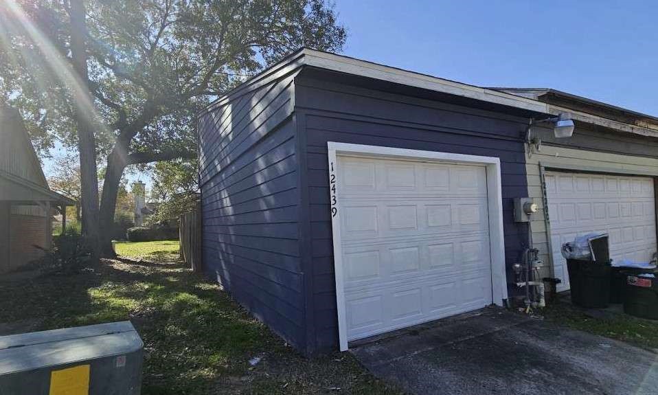 12439 West Village Drive, Unit D Houston, TX 77039 - Photo 7 of 7 a front view of a house with a yard