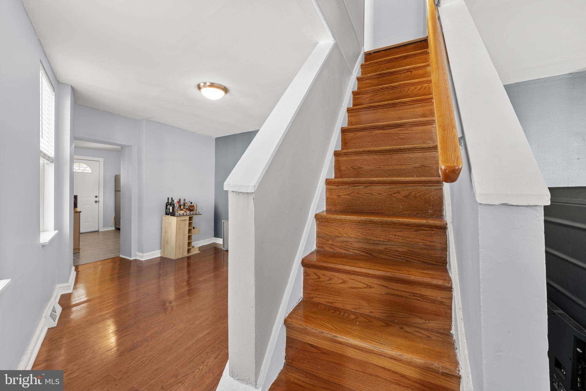 2501 East Norris Street Philadelphia, PA 19125 - Photo 14 of 25 Inviting entryway with warm wooden stairs.