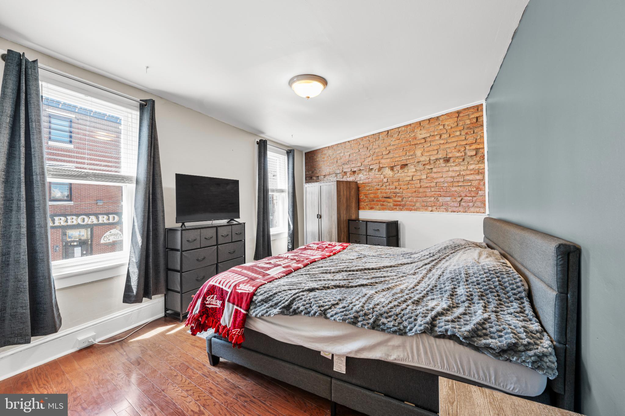 2501 East Norris Street Philadelphia, PA 19125 - Photo 16 of 25 Charming bedroom with exposed brick accents.