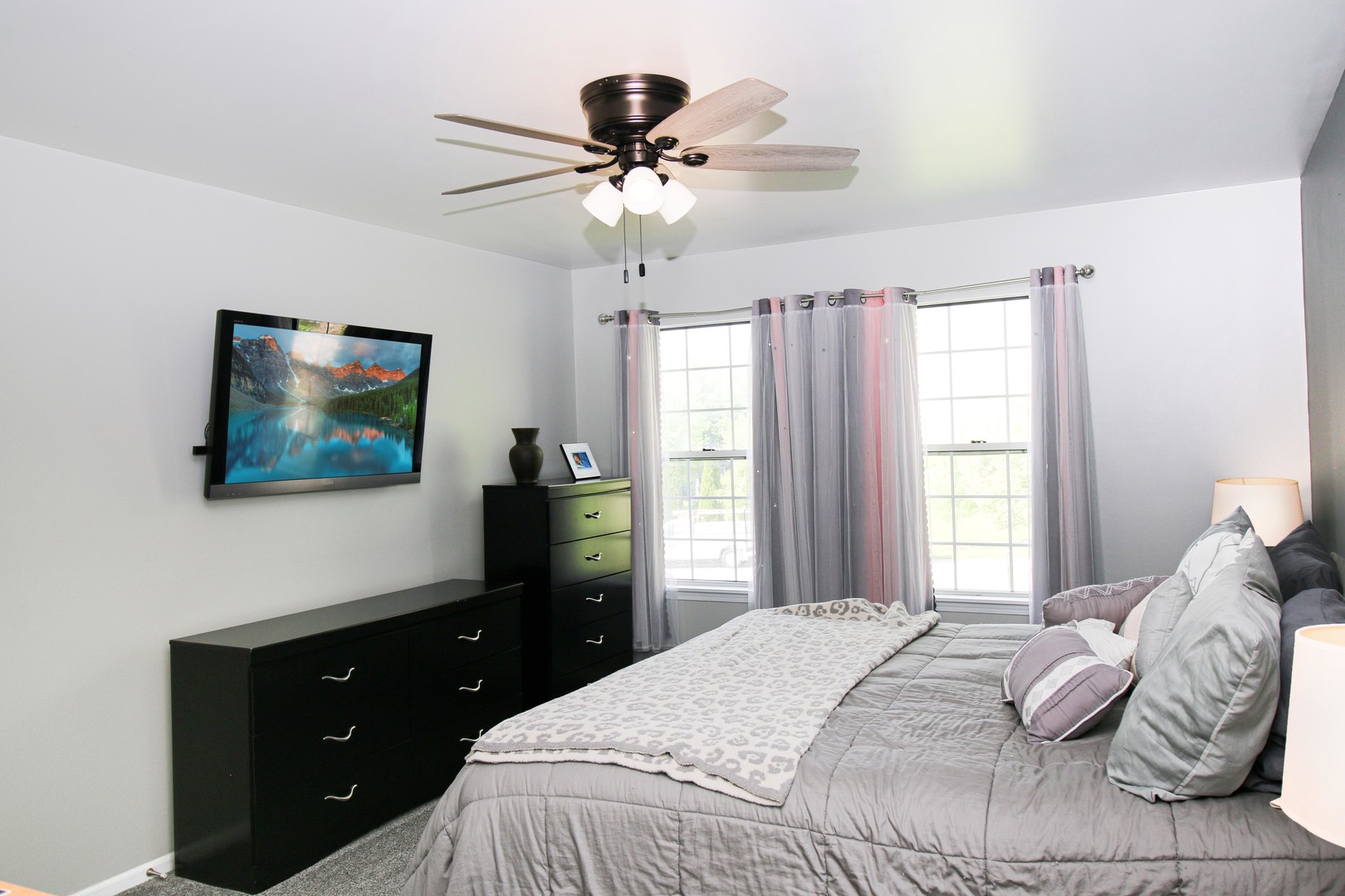 574 Foxford Road Bartlett, IL 60103 - Photo 13 of 22 a bedroom with a bed and a flat screen tv