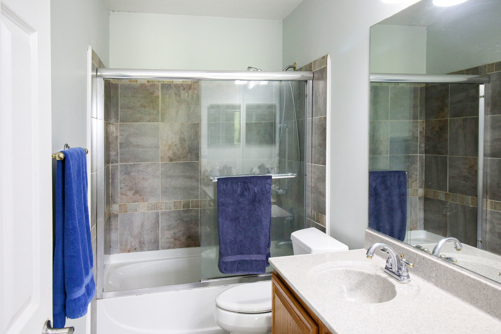 574 Foxford Road Bartlett, IL 60103 - Photo 14 of 22 a bathroom with a sink toilet and shower