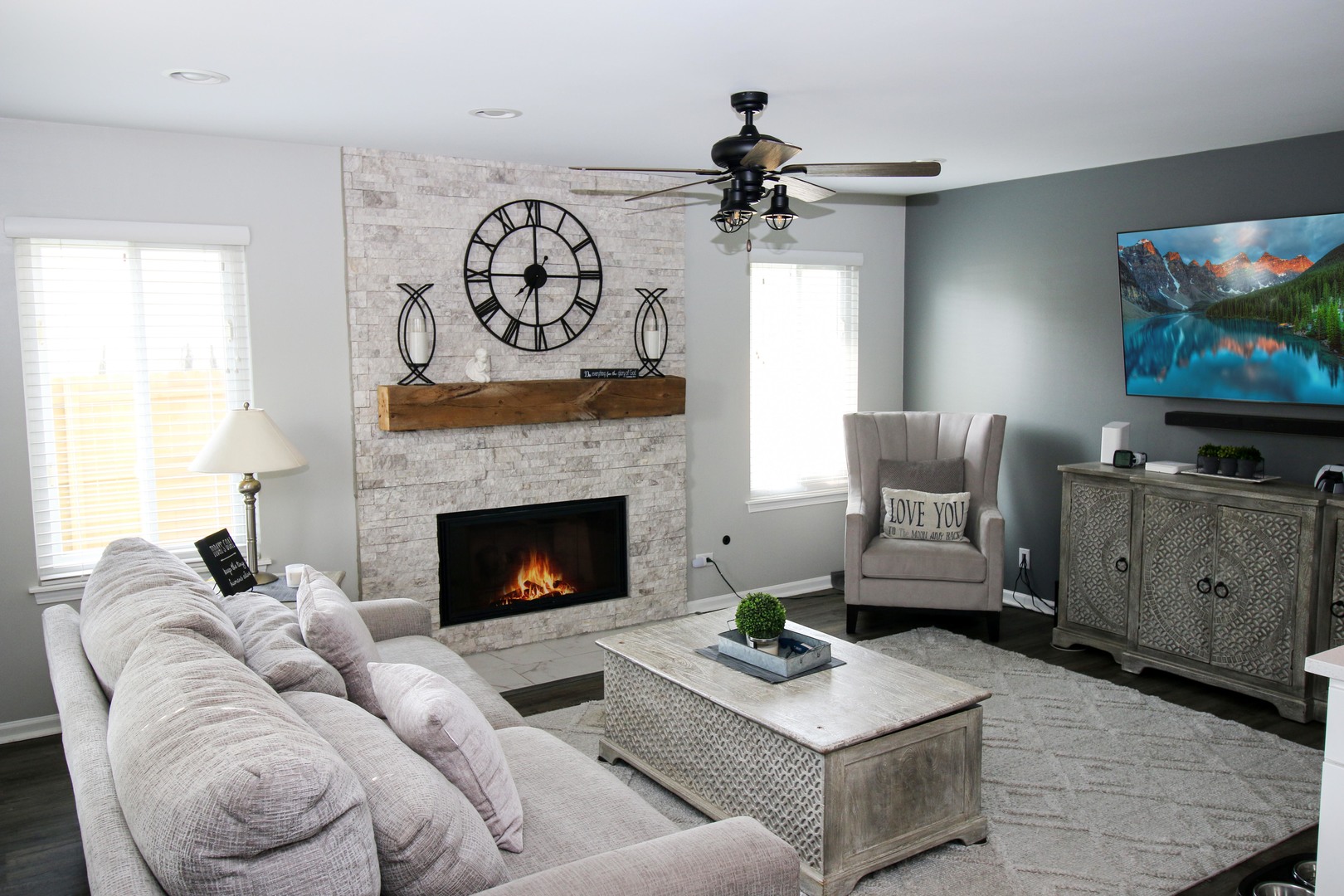 574 Foxford Road Bartlett, IL 60103 - Photo 8 of 22 a living room with furniture a flat screen tv and a fireplace