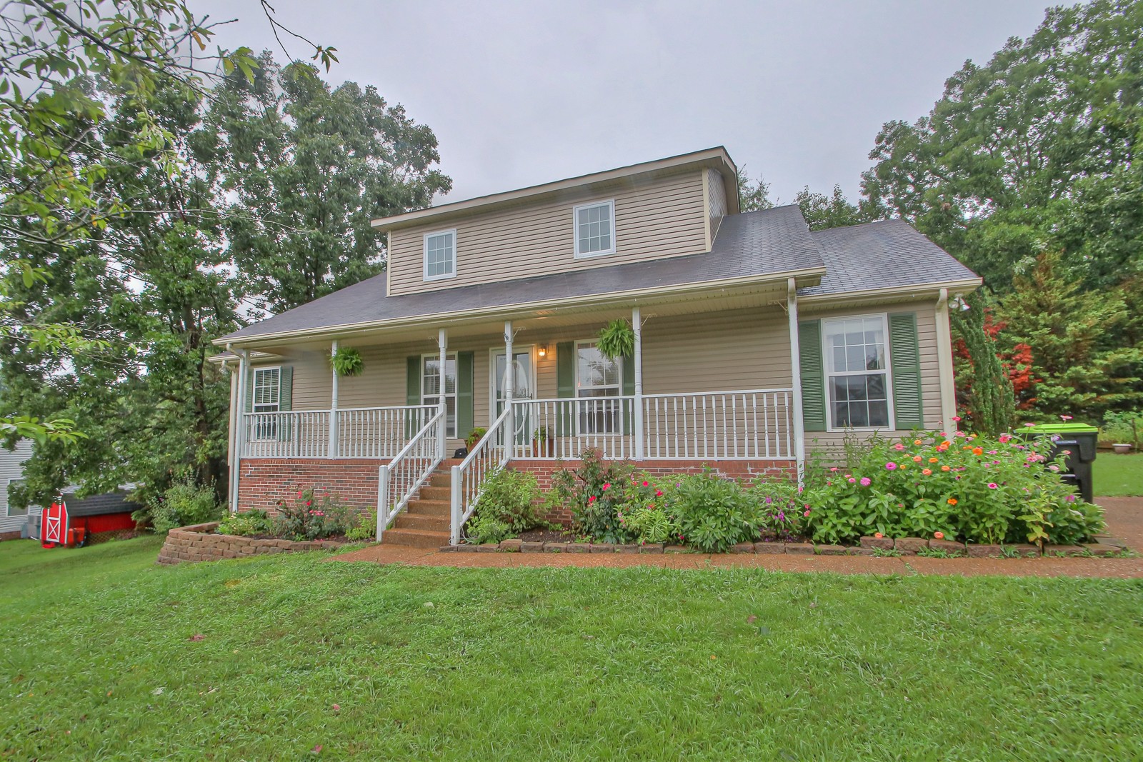 7481 Christopher Street Fairview, TN 37062 - Photo 1 of 42 a view of a house with backyard and garden