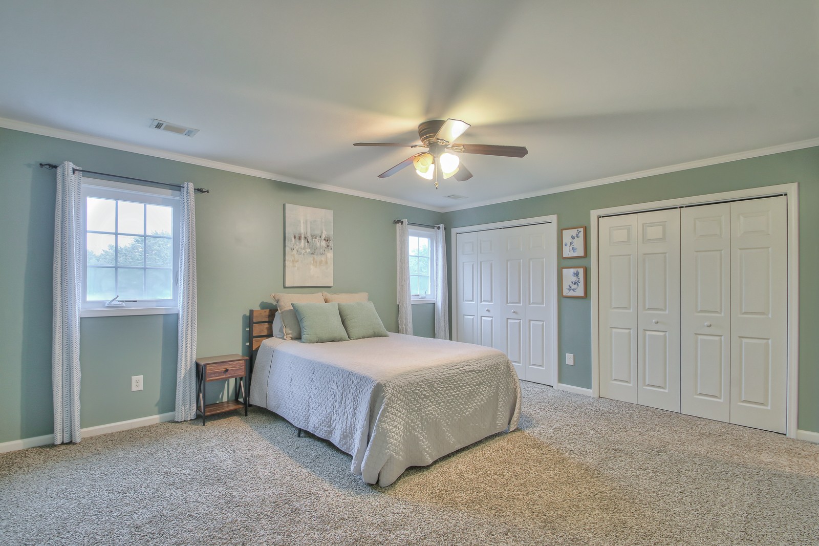 7481 Christopher Street Fairview, TN 37062 - Photo 14 of 42 a bedroom with a bed and a chandelier