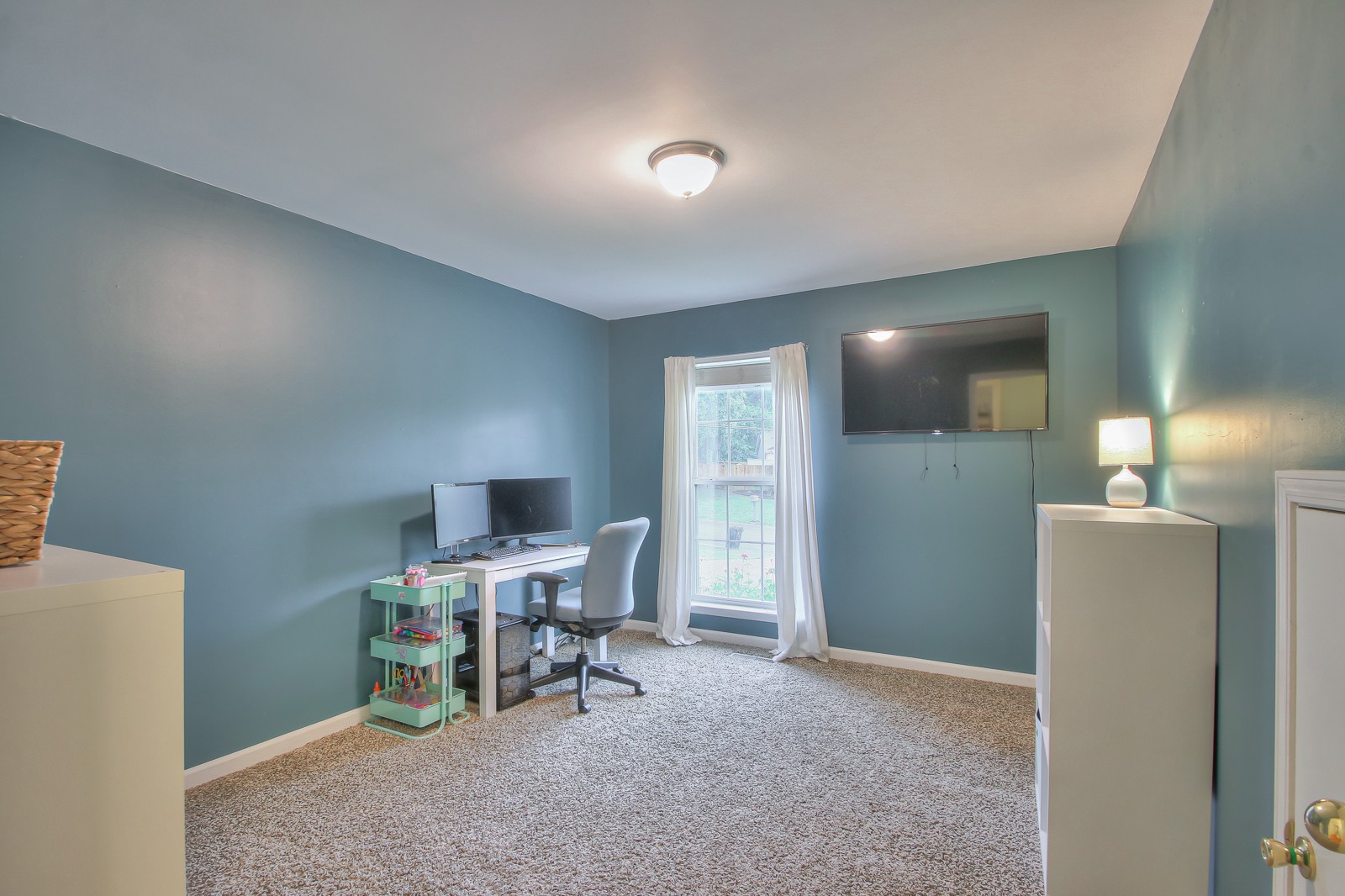 7481 Christopher Street Fairview, TN 37062 - Photo 21 of 42 a view of a livingroom with a chair and a dining table chair