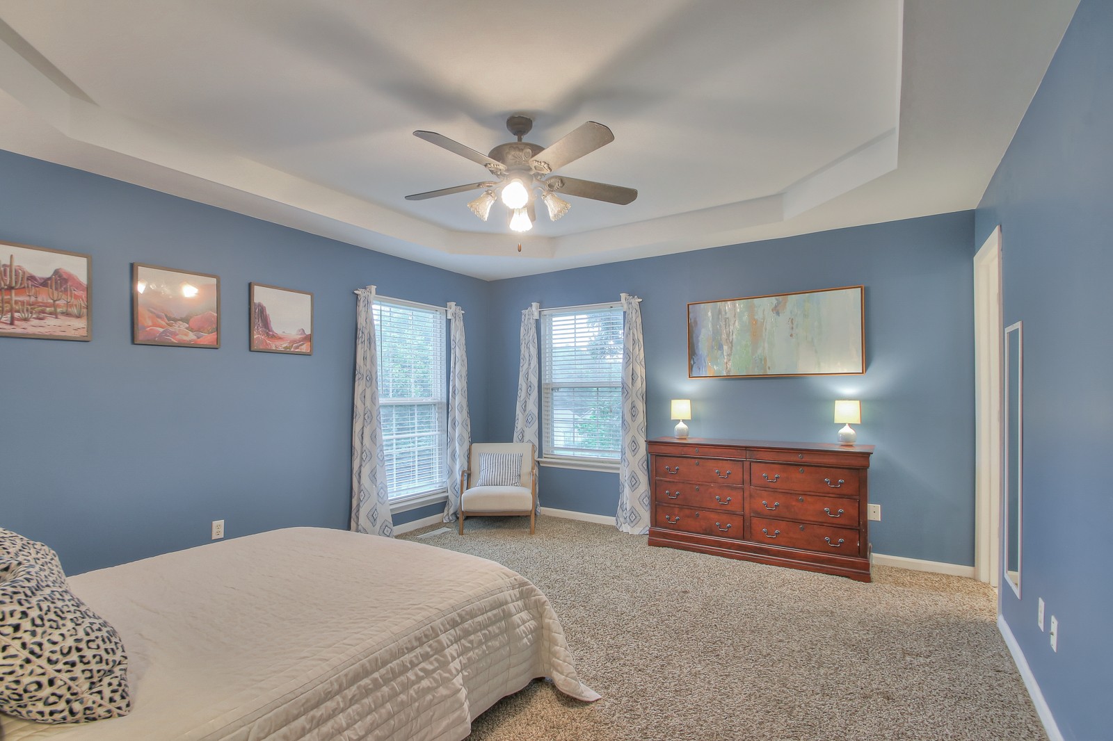 7481 Christopher Street Fairview, TN 37062 - Photo 22 of 42 a bedroom with a bed and a chandelier