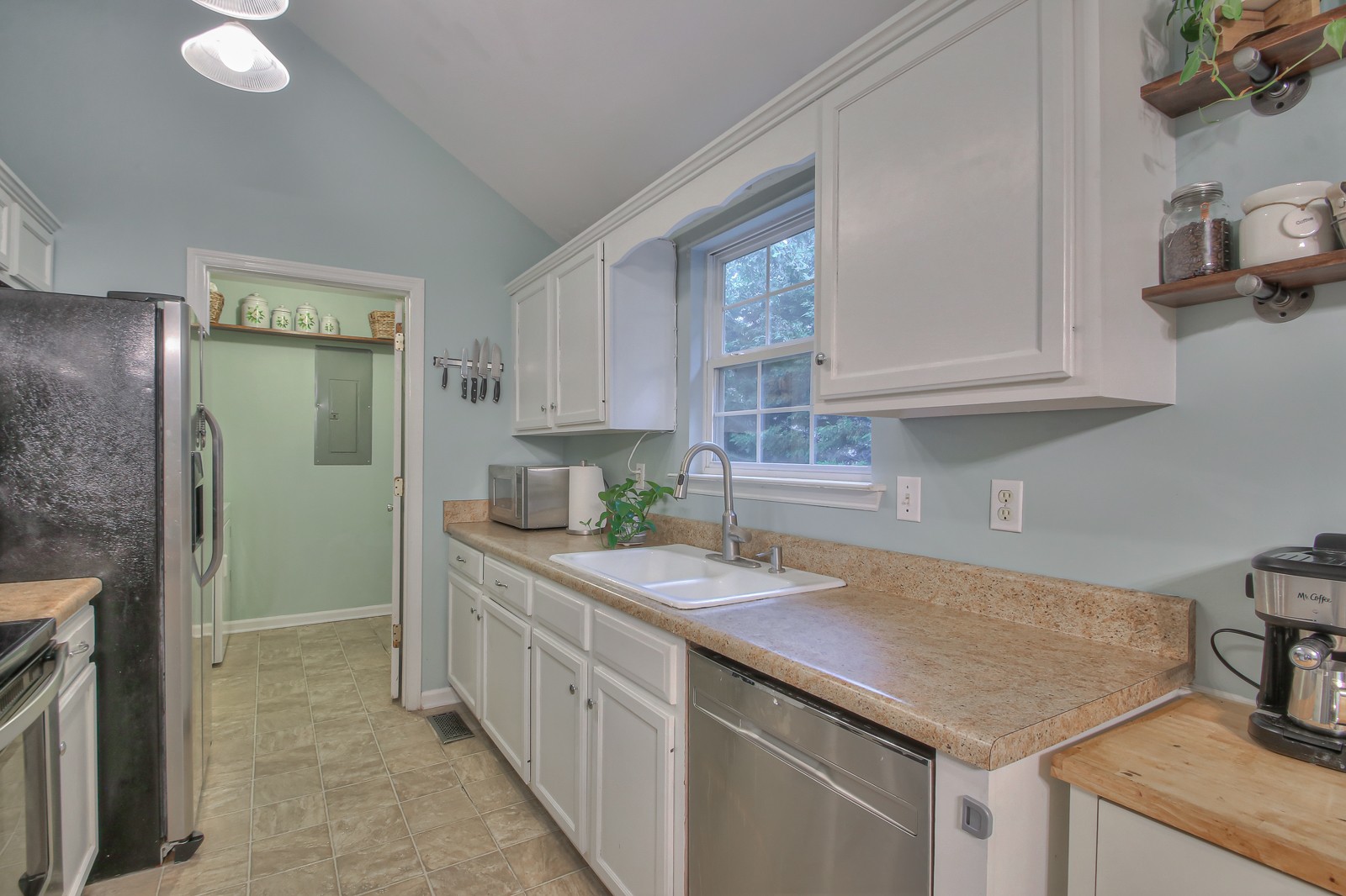 7481 Christopher Street Fairview, TN 37062 - Photo 31 of 42 a kitchen with stainless steel appliances granite countertop a sink and a stove